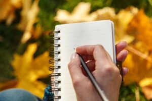 woman-hand-writing-in-notepad