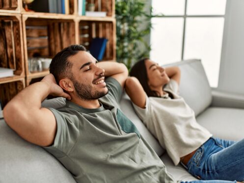 Man and woman relaxing on a couch